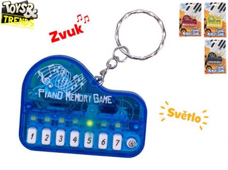 Toys&amp;Trends přívěsek na klíče piano 6cm na baterie se světlem a zvukem 19 skladeb 4barvy